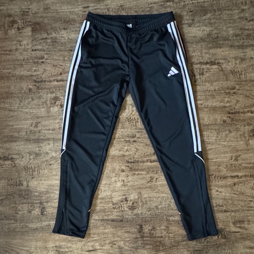 Adidas Womenโs Black Joggers with Lavender Stripes